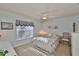 Spacious bedroom with ceiling fan, window, and dresser at 906 Golfview Woods Dr # 906, Ruskin, FL 33573