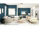 Bright living room featuring a sectional sofa, coffee table, and stylish decor at 32106 Powderpuff Mimosa Dr, San Antonio, FL 33576