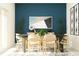 Modern dining room with a large table and stylish chairs at 32106 Powderpuff Mimosa Dr, San Antonio, FL 33576