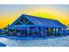 Resort-style pool and outdoor bar with seating area at 32106 Powderpuff Mimosa Dr, San Antonio, FL 33576