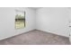Bright bedroom with neutral carpet and window blinds at 6007 Gillot Blvd, Port Charlotte, FL 33981