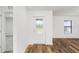 Bright entryway with wood-look flooring and frosted glass door at 6007 Gillot Blvd, Port Charlotte, FL 33981