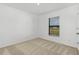 Bedroom featuring neutral carpeting and window blinds at 13315 Flaherty Ave, Port Charlotte, FL 33981