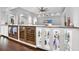 Elegant bar area featuring wine refrigerators, glass shelving, and stylish lighting at 5016 Givendale Ln, Tampa, FL 33647