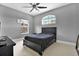 Comfortable bedroom with neutral colors, large windows, and ample natural light at 5016 Givendale Ln, Tampa, FL 33647