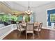 Bright dining room offering views of the lanai and pool at 5016 Givendale Ln, Tampa, FL 33647