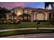 Elegant home featuring manicured landscaping and classic architectural details at 5016 Givendale Ln, Tampa, FL 33647