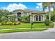 Elegant two-story home with lush landscaping and a grand entrance at 5016 Givendale Ln, Tampa, FL 33647