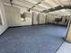 A well-organized garage features epoxy floors and full wall of custom storage cabinets at 5016 Givendale Ln, Tampa, FL 33647