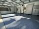 Spacious garage featuring epoxy floors and custom cabinets for ample storage at 5016 Givendale Ln, Tampa, FL 33647
