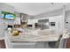 Spacious kitchen features a large granite island, stainless steel appliances, and custom cabinetry at 5016 Givendale Ln, Tampa, FL 33647