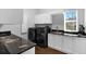 Modern laundry room with granite countertops and updated washer and dryer at 5016 Givendale Ln, Tampa, FL 33647