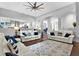 Spacious living room with elegant decor and hardwood floors, providing a luxurious and comfortable living space at 5016 Givendale Ln, Tampa, FL 33647