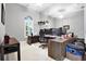 Well-lit home office with expansive desk space, modern monitors, and a minimalist aesthetic at 5016 Givendale Ln, Tampa, FL 33647