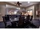 This home boasts an outdoor kitchen and dining area with granite counters and stainless steel grill at 5016 Givendale Ln, Tampa, FL 33647