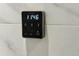 Close-up of modern digital shower controller with a sleek black design at 5016 Givendale Ln, Tampa, FL 33647