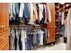 Custom wood shelving and drawers provides ample storage in this large walk-in closet at 5016 Givendale Ln, Tampa, FL 33647
