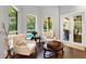 Bright sitting room featuring French doors opening to the backyard at 5016 Givendale Ln, Tampa, FL 33647