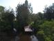Wooden dock on calm waterway with lush vegetation at 6109 Adams St, Gibsonton, FL 33534