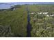Aerial view of waterfront property with canal at 6109 Adams St, Gibsonton, FL 33534