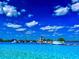 Expansive Crystal Lagoon with inflatable watersports at 32088 Powderpuff Mimosa Dr, San Antonio, FL 33576