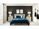 Cozy bedroom with dark walls and teal bedding at 32088 Powderpuff Mimosa Dr, San Antonio, FL 33576