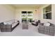 Covered patio features comfortable seating and a view of the backyard at 839 Tierra Dr, Spring Hill, FL 34609