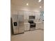 Kitchen with stainless steel appliances and white cabinets at 12831 Oriago St, Venice, FL 34293