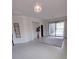 Bright living room featuring tile floors and sliding glass doors leading to a patio at 12831 Oriago St, Venice, FL 34293