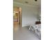 Bright bedroom with ensuite bathroom and tile flooring at 12831 Oriago St, Venice, FL 34293