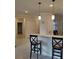 Kitchen with breakfast bar and view into the dining area at 12831 Oriago St, Venice, FL 34293