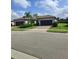 Two-story house with a two car garage and landscaped yard at 12831 Oriago St, Venice, FL 34293