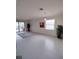 Bright living room with tile flooring and large windows at 12831 Oriago St, Venice, FL 34293