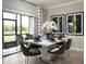 Modern dining room with table for six and access to a screened patio at 32112 Powderpuff Mimosa Dr, San Antonio, FL 33576
