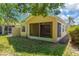 Expansive backyard featuring a screened-in porch perfect for relaxation at 8049 Sanguinelli Rd, Land O Lakes, FL 34637