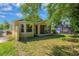 Spacious backyard featuring a screened-in porch and lush green lawn at 8049 Sanguinelli Rd, Land O Lakes, FL 34637