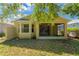Exterior view of the backyard showing the enclosed patio at 8049 Sanguinelli Rd, Land O Lakes, FL 34637