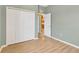 Bedroom featuring vinyl floors, gray walls and a closet at 8049 Sanguinelli Rd, Land O Lakes, FL 34637