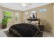 Cozy bedroom features carpet, natural light, ceiling fan and neutral paint at 8049 Sanguinelli Rd, Land O Lakes, FL 34637