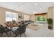 Spacious living room and dining area with natural light, neutral paint and modern furnishings at 8049 Sanguinelli Rd, Land O Lakes, FL 34637