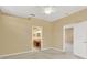 View of the en-suite bathroom from the carpeted main bedroom at 8049 Sanguinelli Rd, Land O Lakes, FL 34637