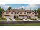 New townhome community with attached garages and landscaping at 10368 Honey Hammock Way, San Antonio, FL 33576