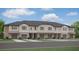 Modern townhome community with attached garages and neutral colors at 10384 Honey Hammock Way, San Antonio, FL 33576