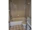 Clean bathroom with tan tile, a bathtub, toilet, and vanity at 303 E Wellington Ct # 59, Tampa, FL 33604