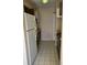 Small kitchen with white appliances and tiled floor at 303 E Wellington Ct # 59, Tampa, FL 33604