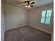 Bright bedroom with ceiling fan and neutral carpeting at 16320 Hyde Manor Dr, Tampa, FL 33647