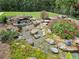 Landscaped backyard with a relaxing water feature at 16320 Hyde Manor Dr, Tampa, FL 33647