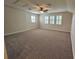 Spacious bonus room with neutral carpet and ceiling fan at 16320 Hyde Manor Dr, Tampa, FL 33647