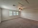 Bright bonus room featuring carpet and window shutters at 16320 Hyde Manor Dr, Tampa, FL 33647