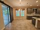 Open dining area with tile flooring and access to the kitchen and back patio at 16320 Hyde Manor Dr, Tampa, FL 33647